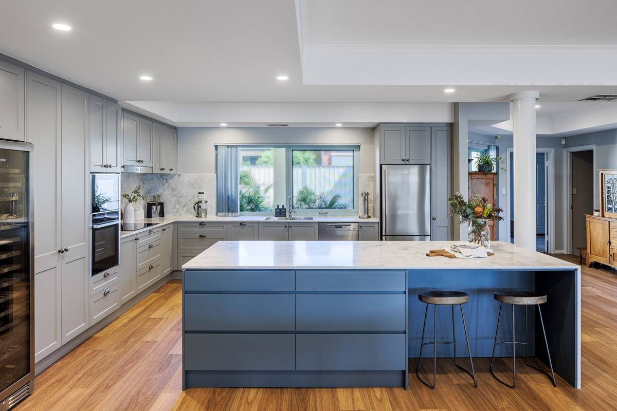 renovated kitchen, new flooring and layout with large kitchen island, built-in appliances, stone sops and splashback, contemporary and luxurious.