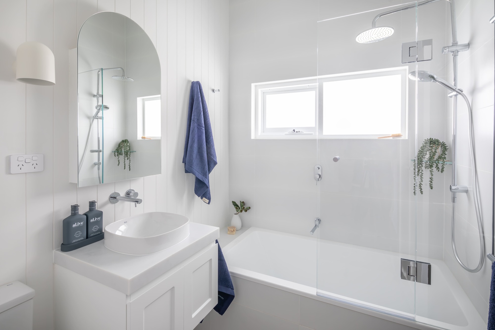 Hamptons Style Family Bathroom with V-Jay Panelling, Floating Vanity, Mirror Cabinet, Tiled Bathtub and Chrome Accessories