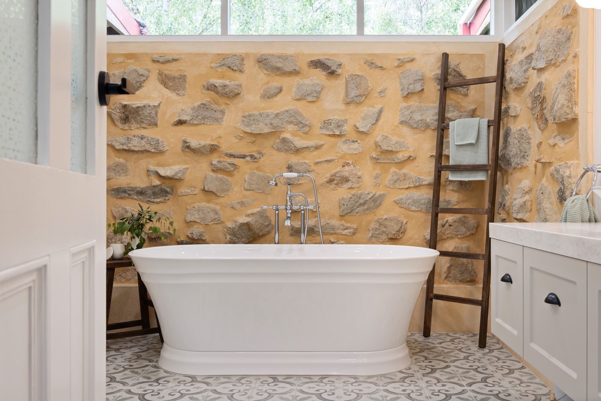 Hamptons Style Bathroom with Classic Self-Standing Bathtub, Chrome Tapware, Mosaic Floor Tiles and Limestone Feature Wall