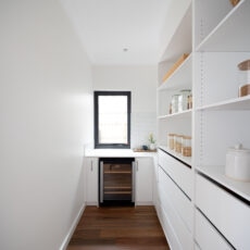 Contemporary classic walk-in pantry with wine fridge