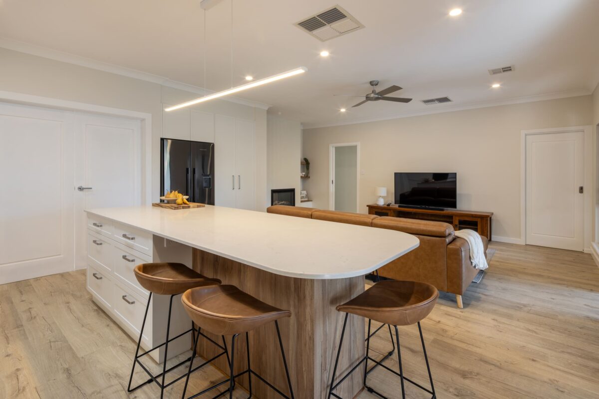 renovated kitchen and living areas, featured fireplace, open plan with new flooring, bespoke joinery, kitchen island with functional storage