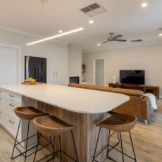 renovated kitchen and living areas, featured fireplace, open plan with new flooring, bespoke joinery, kitchen island with functional storage
