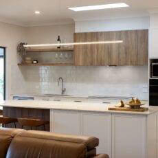 renovated kitchen and living areas, open plan design with bespoke joinery, kitchen island with functional storage, ceiling skylight and new appliances.