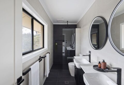 renovated bathroom, monochromatic and contemporary, black tapware, double vanity and walk-in shower with bench seat