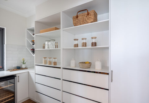 renovated walk-in pantry with open shelves, drawers and wine fridge