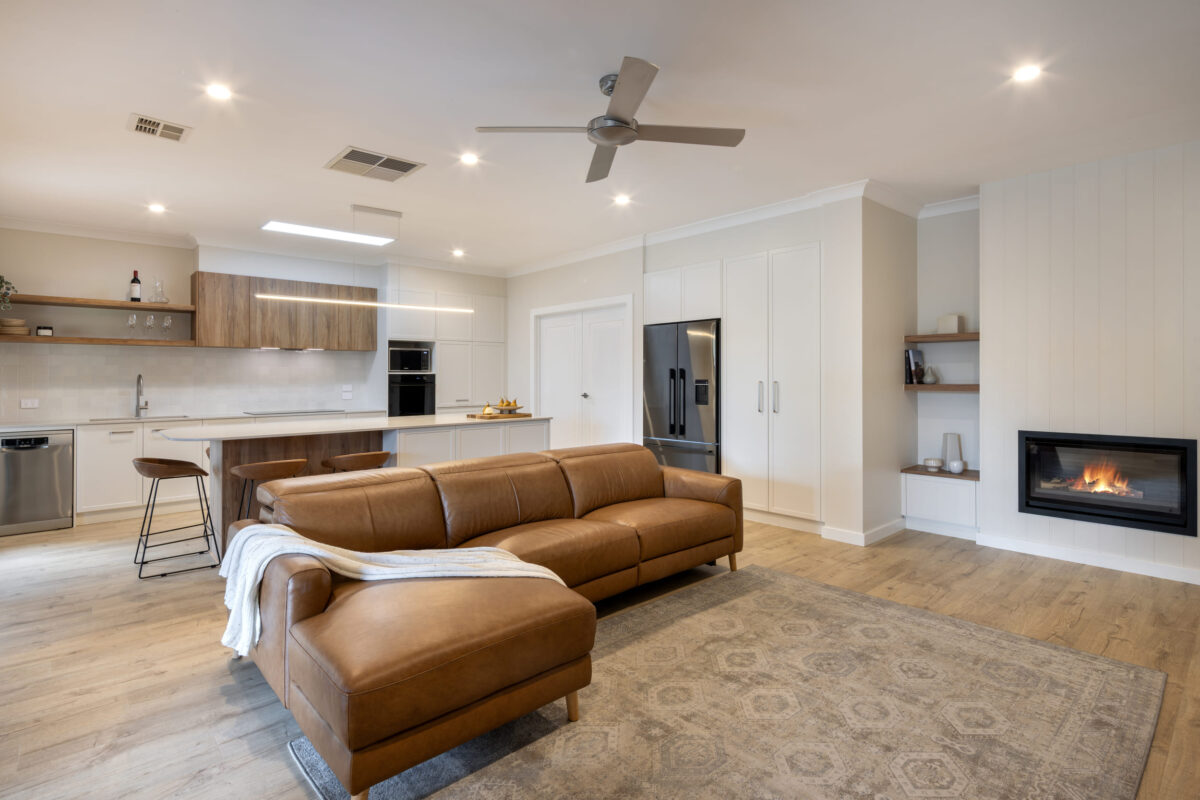 renovated kitchen and living areas, featured fireplace, open plan with new flooring, bespoke joinery, skylight and new appliances.