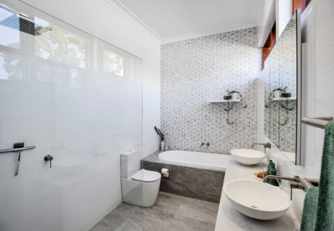 renovated bathroom, decorative wall tiles, bathtub and open shower