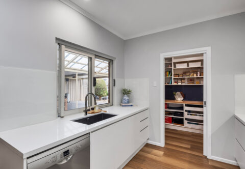 renovated scullery, custom cabinetry, undermounted sink, Bosch dishwasher and large window
