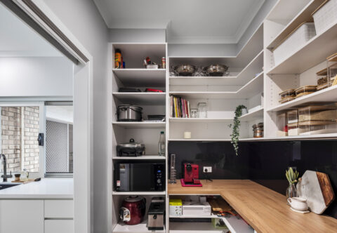 renovated walk-in pantry with custom joinery, open shelves, glass splashback and wooden finish benchtop