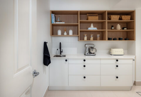 renovated scullery, part of an extension, bespoke joinery with open shelves, drawers, sink and tiled floor