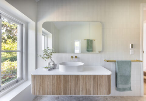 renovated bathroom, first story home, white matt mosaic feature wall, floating vanity, shaving mirror cabinets, underfloor heating and sensor lights