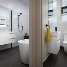 renovated bathroom and WC, the WC has compact basin and the adjacent bathroom a large vanity, mirror cabinets and open walk-in shower.