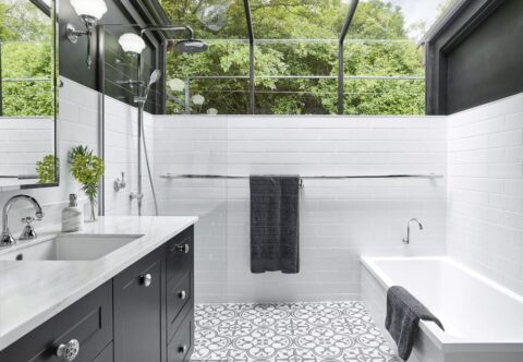 renovated bathroom, monochromatic style, half glass roof, open walk-in shower, patterned porcelain floor tiles, chrome joinery