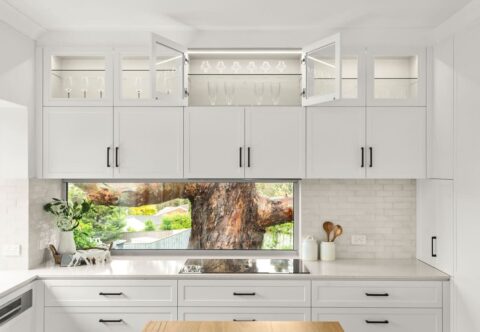 renovated kitchen, contemporary - country style, new kitchen island in solid timber benchtop in a Wormy Chestnut finish; bespoke joinery in white paired with black handles; extend the original 1990s Brushbox parquetry flooring into the kitchen area.