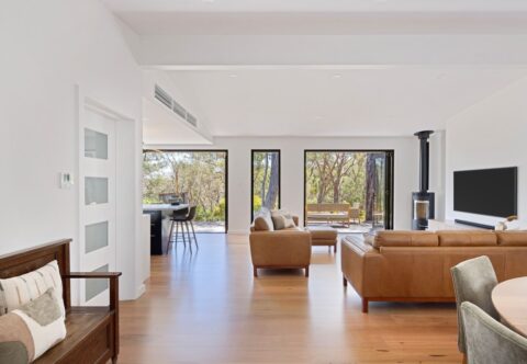 renovated living and dining areas, corner fireplace, open plan with new solid wood flooring, large bi-fold doors opened to bushy view. Structural changes made by a licenced builder, Brilliant SA Renovations.
