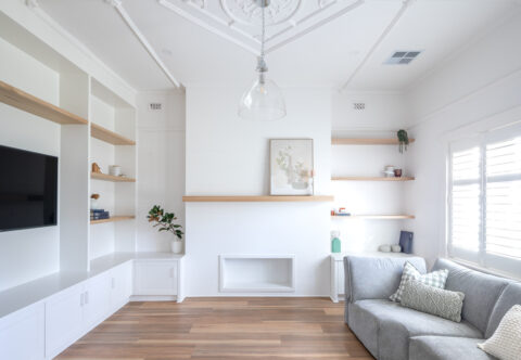renovated family room with new floorboards, floating cabinets in timber finish, well lid space