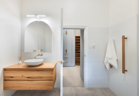 renovated bathroom, contemporary style, floating vanity in solid American Chestnut, recessed shaving cabinet, gold tapware