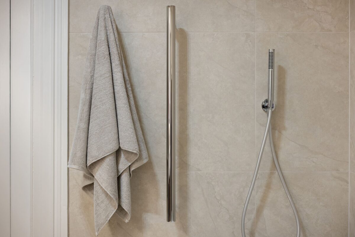 renovated bathroom with vertical heated towel rails