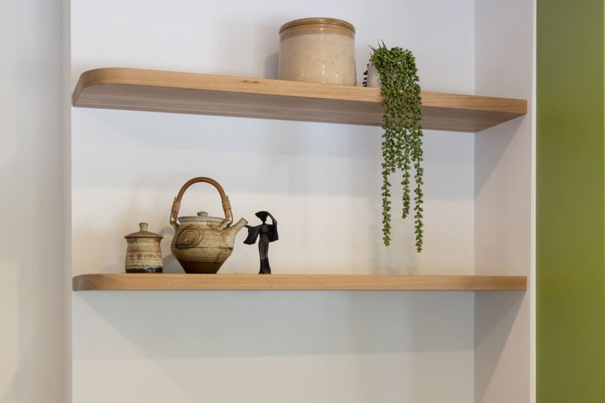 Renovated kitchen with solid timber shelves.