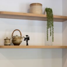 Renovated kitchen with solid timber shelves.